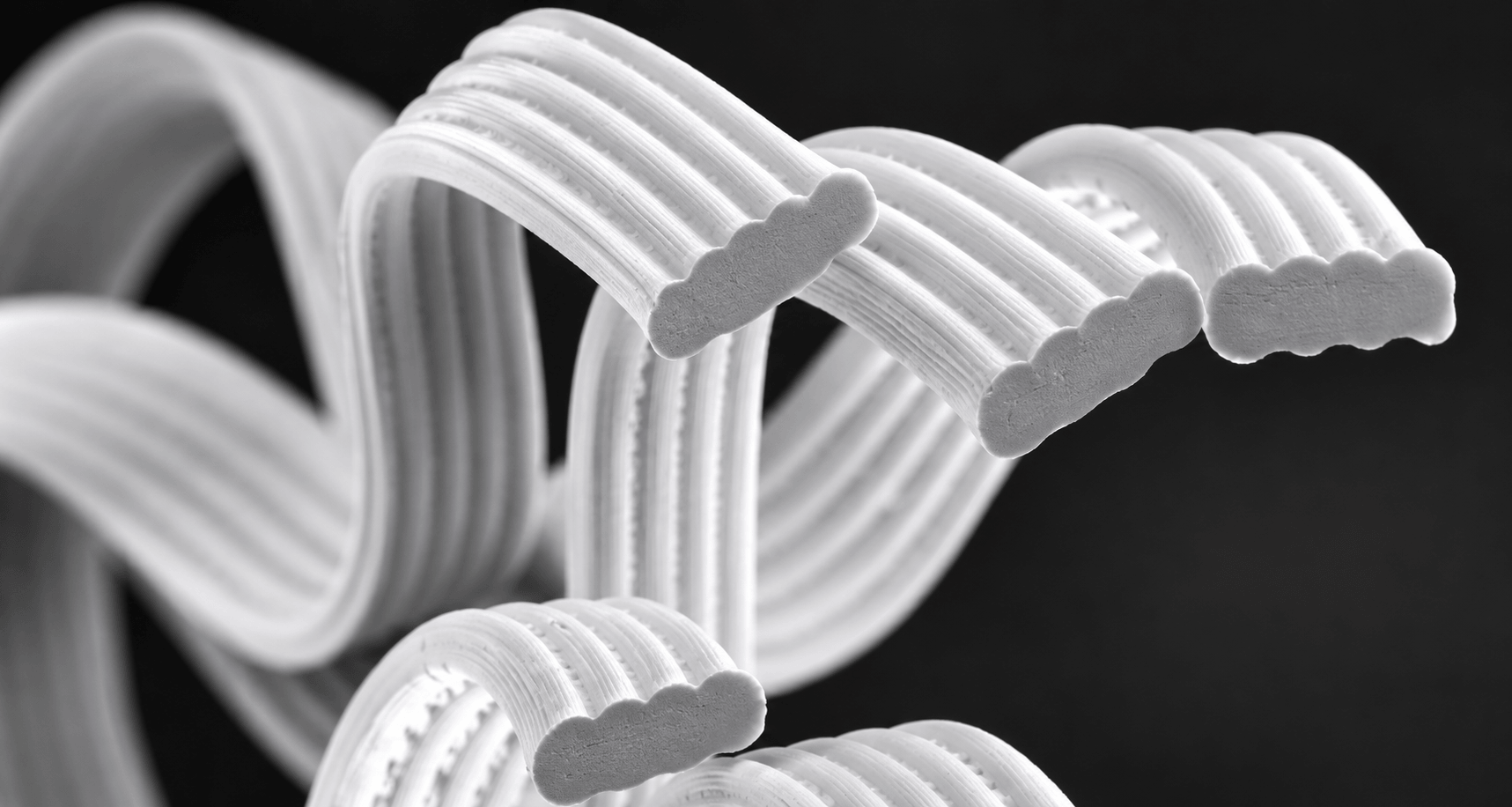 Flat and wavy cross-section filament